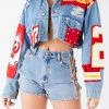 FURST OF A KIND VINTAGE NFL VINTAGE JERSEY PATCHWORK STUDDED CROPPED DENIM JACKET